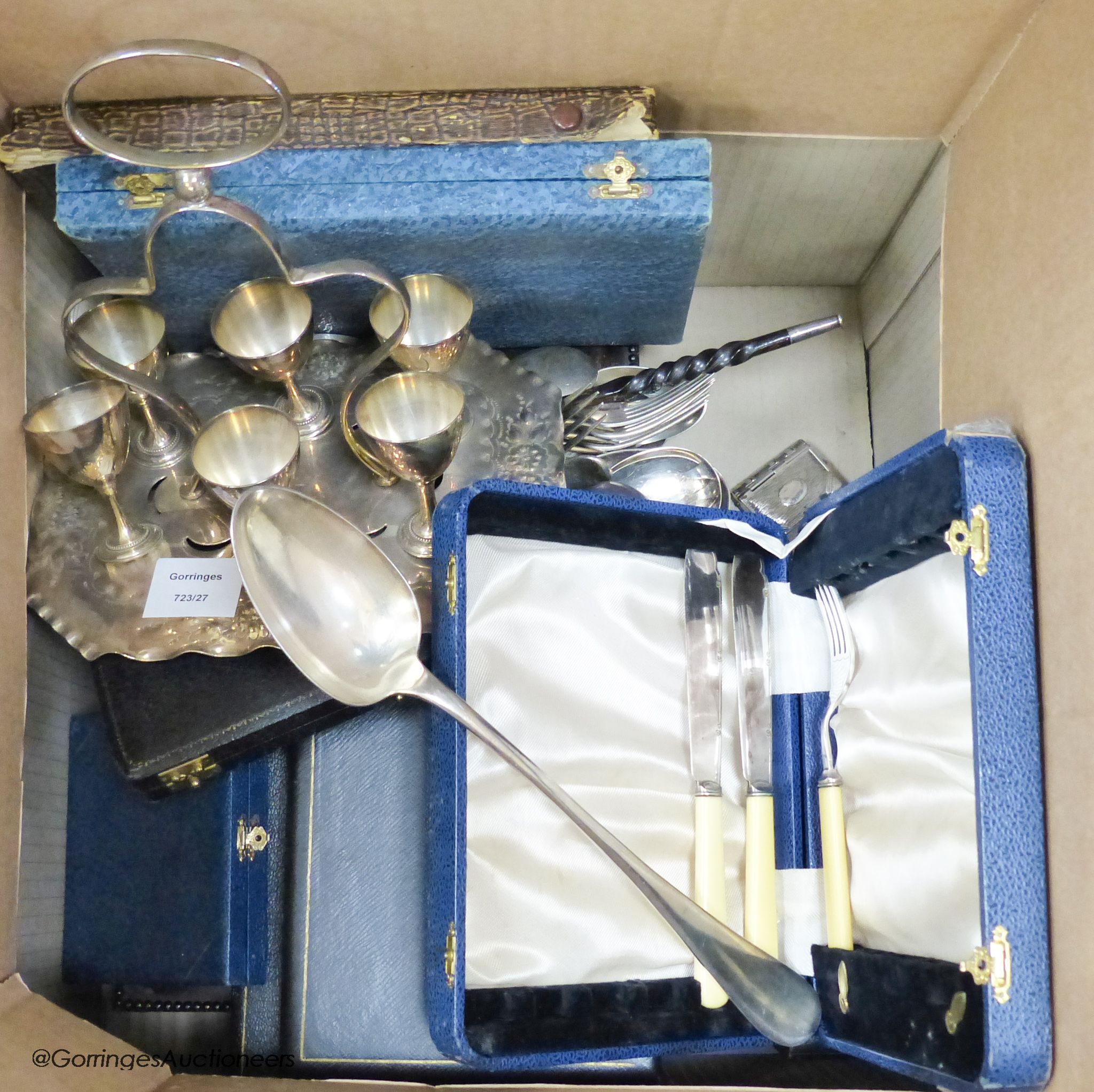 A plated egg cruet, a tray and sundry cased sets of plated flatware